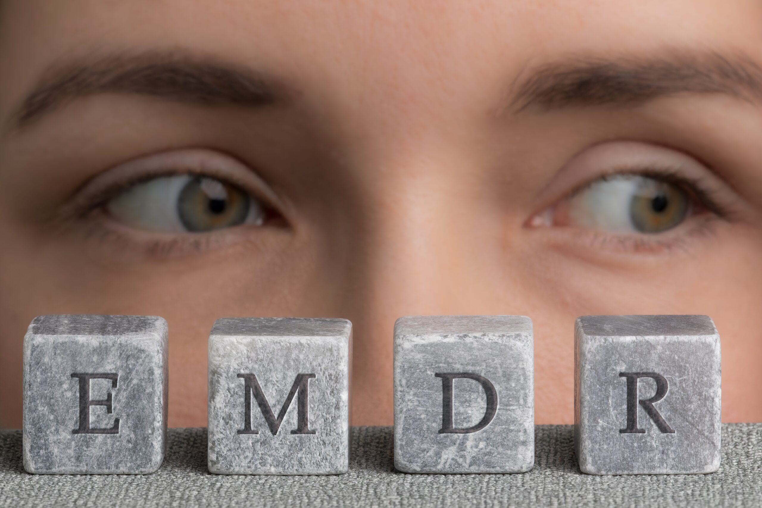 Letters,Emdr,Written,On,Grey,Stone,Cubes,Blocks.,Close-up,Woman's